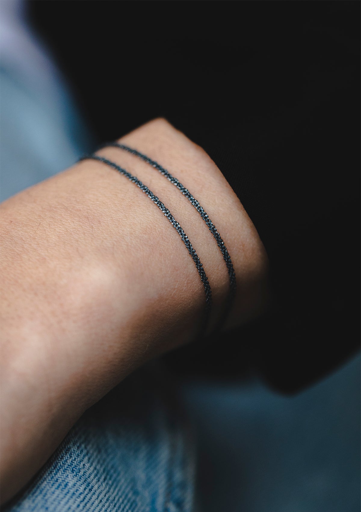 Oxidized sterling silver bracelet with double chains styled on wrist