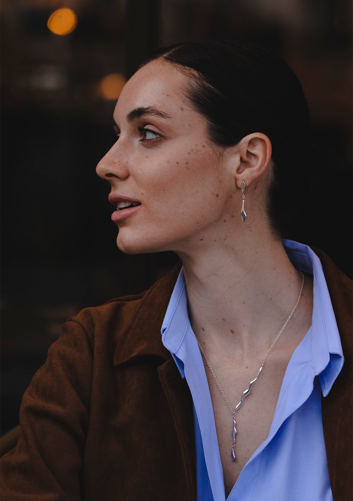 Sleek dangle earrings in sterling silver, handcrafted with elongated pendant design