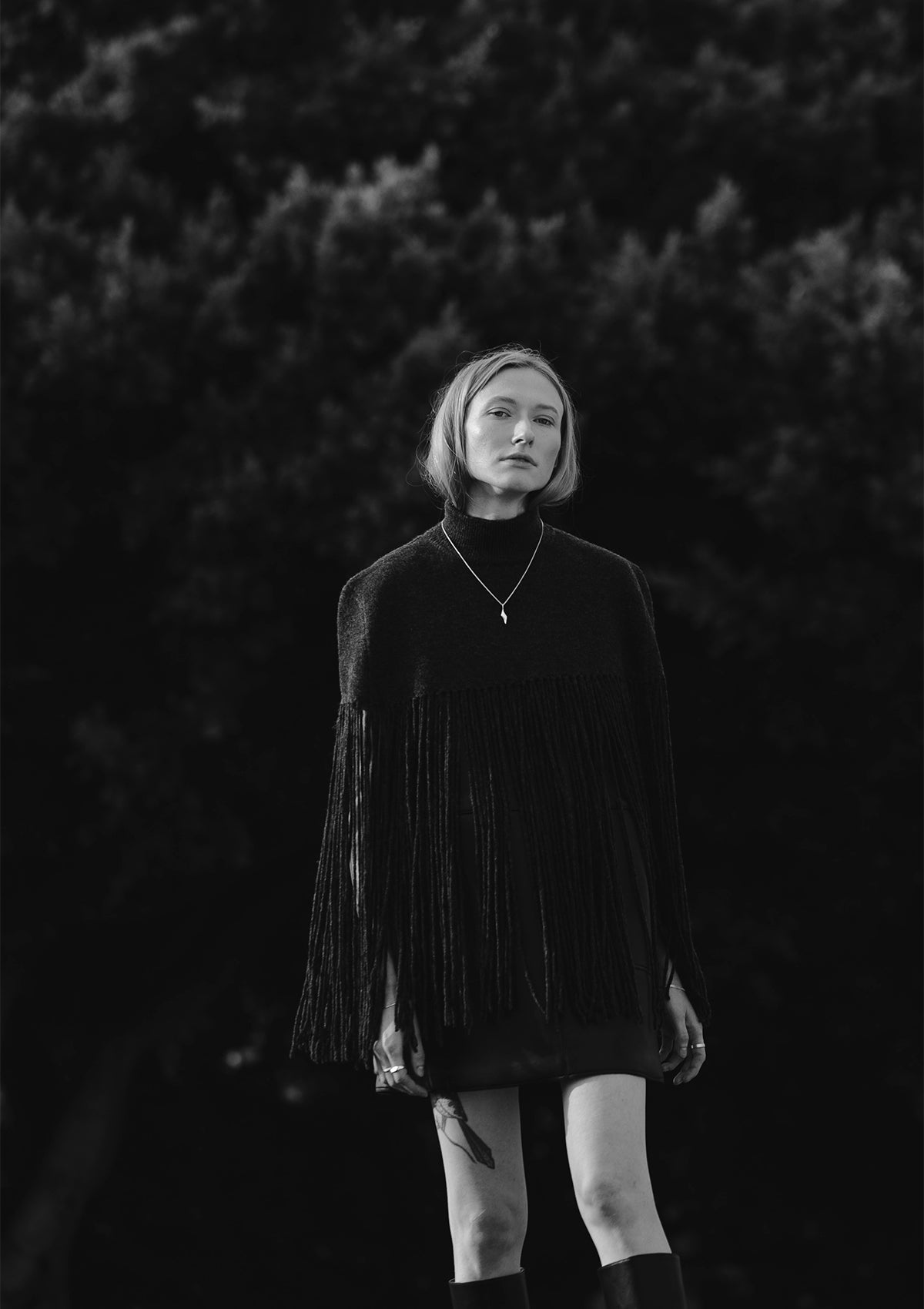 Monochrome portrait with long sterling silver necklace, elegant minimalist jewelry