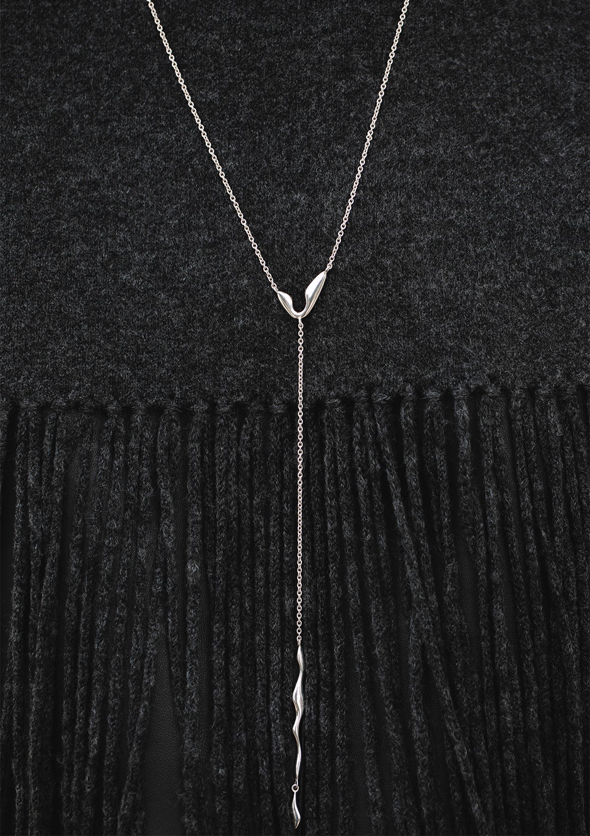 Long handcrafted necklace with signature wavy silver pendants, unique minimalist jewelry design
