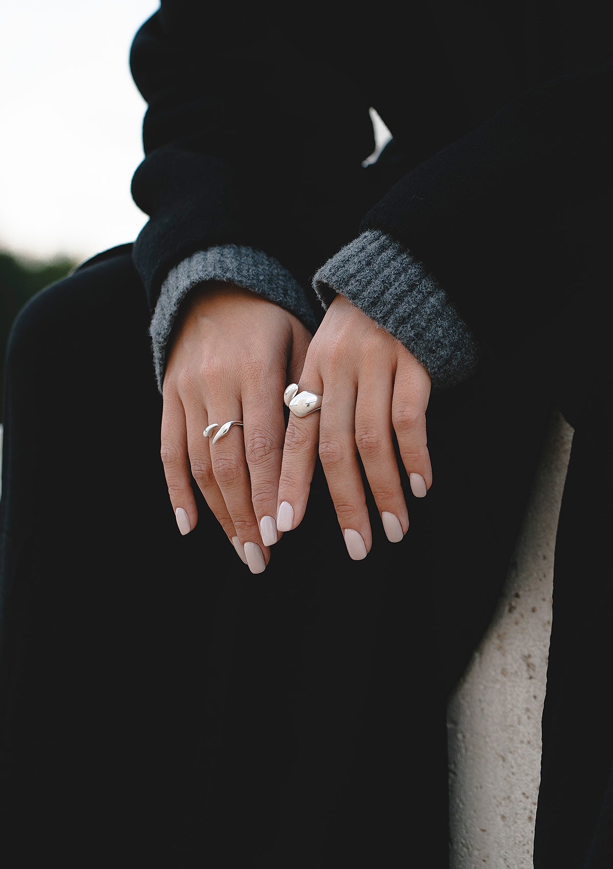 Close-up of sleek open ring with flowing shape – bold minimal jewelry piece