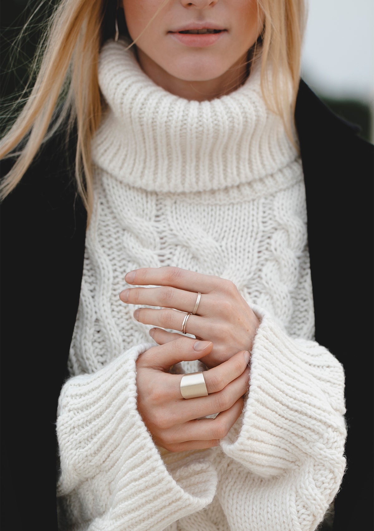 Minimalist wide silver ring with sculptural form, modern casual styling with warm tones, handmade jewelry piece