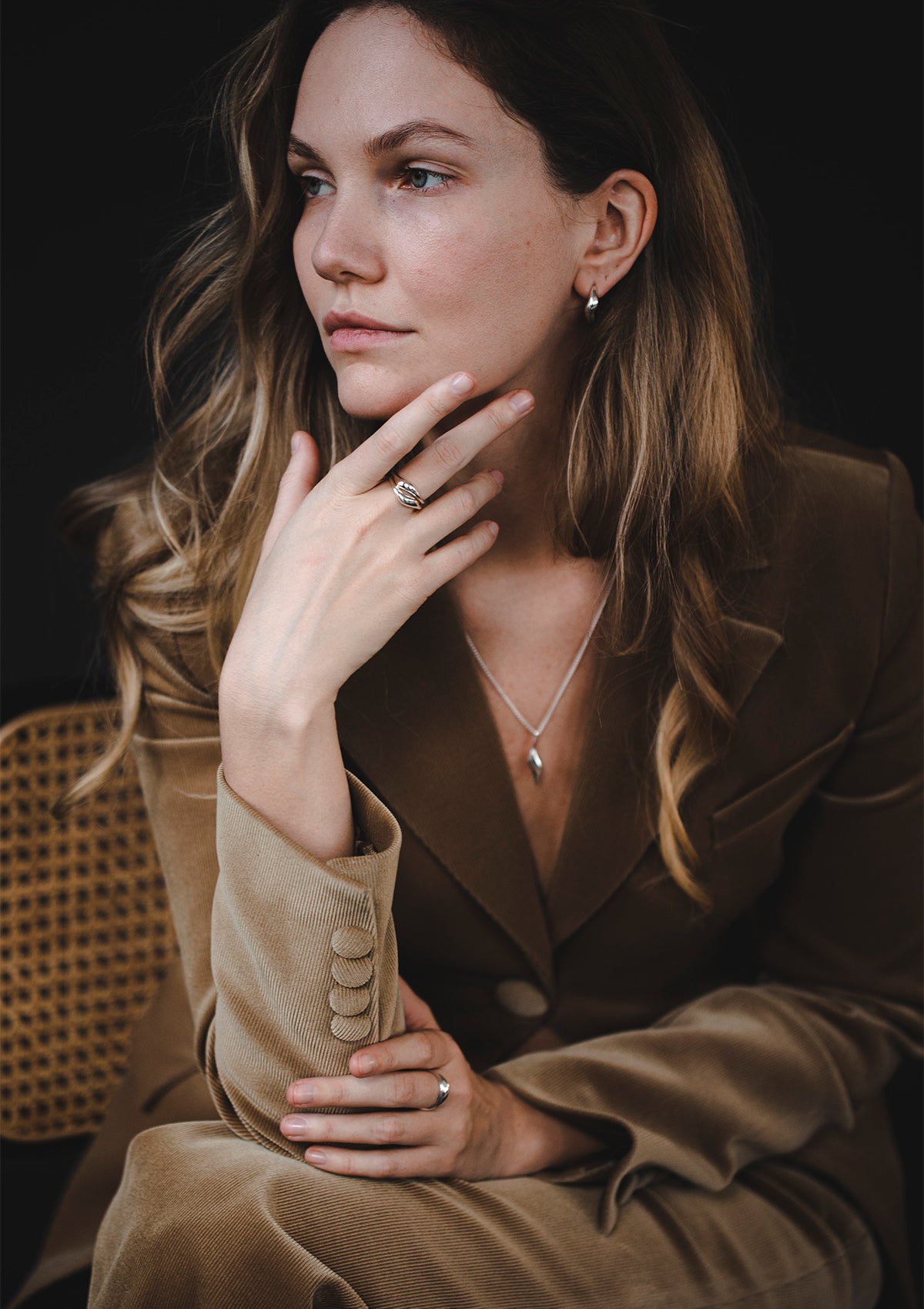 Model wearing Gal ring in sterling silver, refined minimalist jewelry