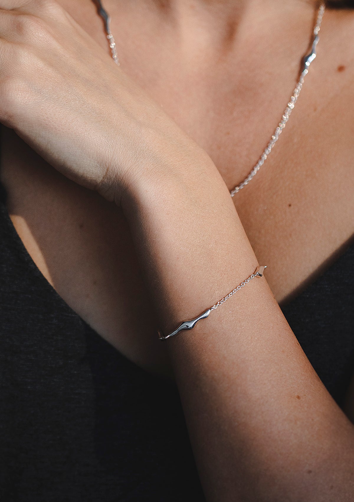 Delicate bracelet with three wave-like forms, feminine silver jewelry styled for everyday wear