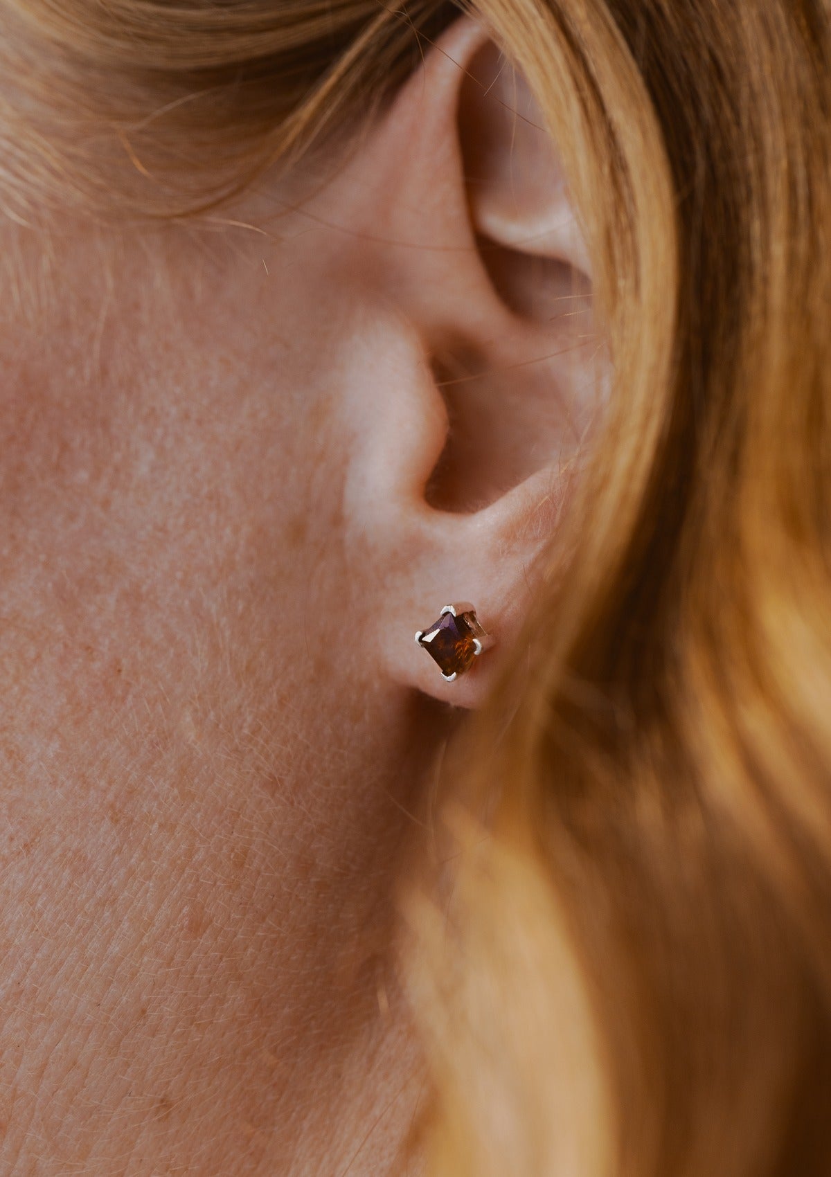 Brown orange zirconia studs — на теле