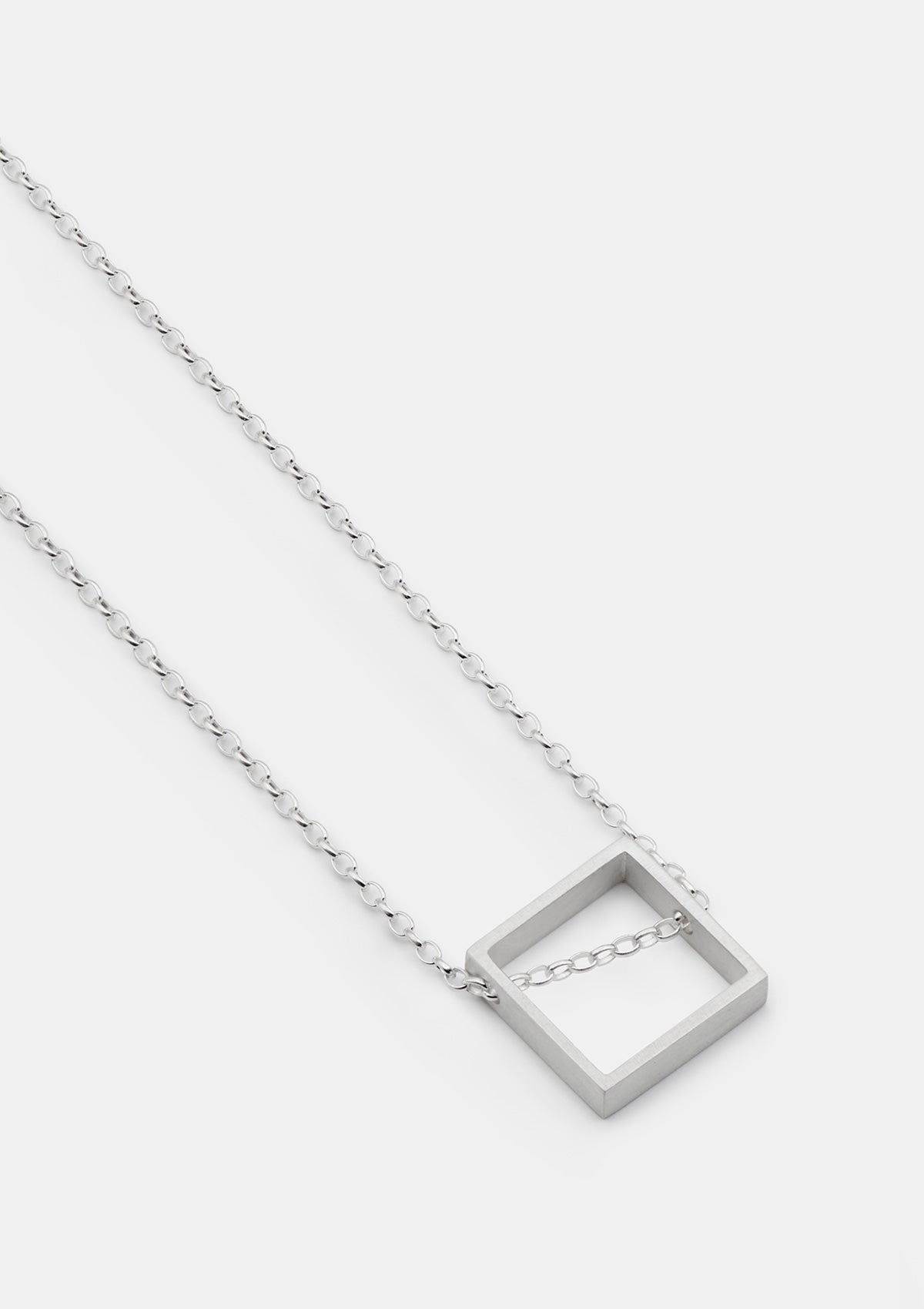 925 sterling silver square pendant necklace with matte finish, modern geometric shape on light gray backdrop