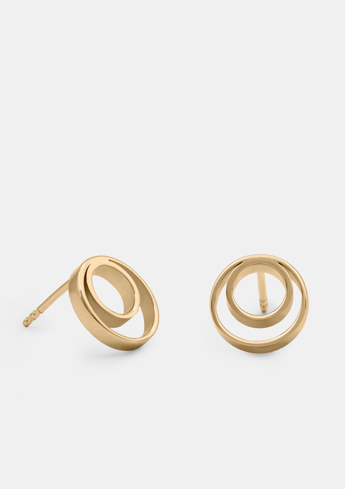14K yellow gold round stud earrings with open circle design, minimalist geometric shape, displayed on bright clean background