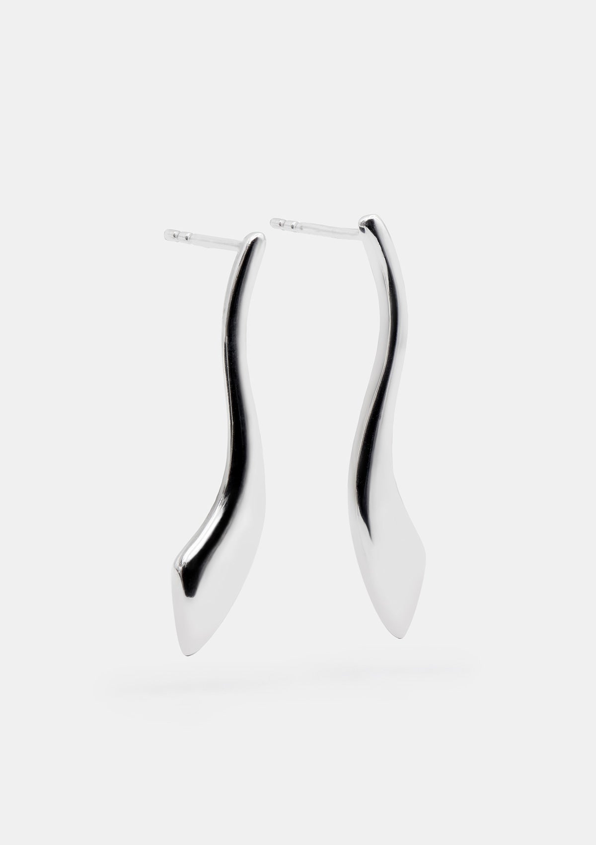 Sterling silver statement earrings with bold flat shape, medium sculptural design photographed flat