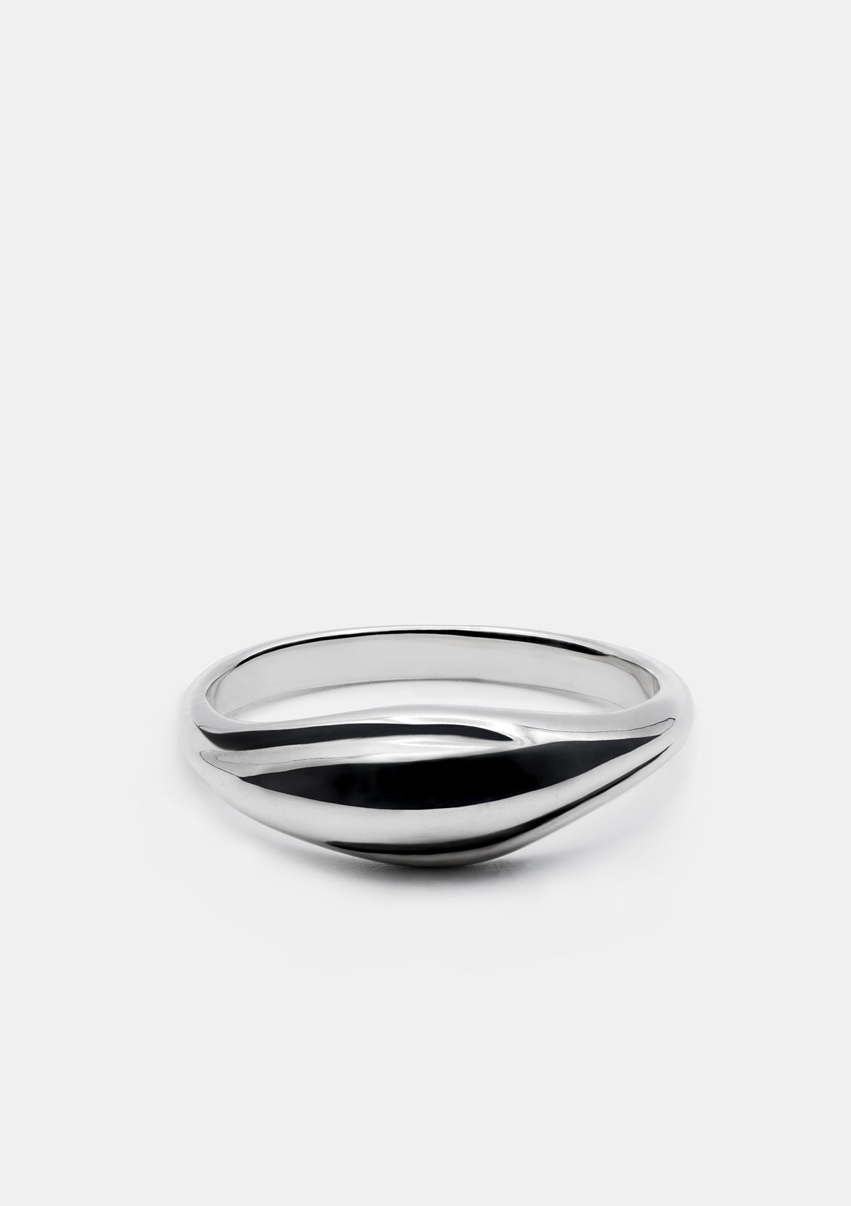 Minimalist domed ring in polished sterling silver, lying flat on a white background