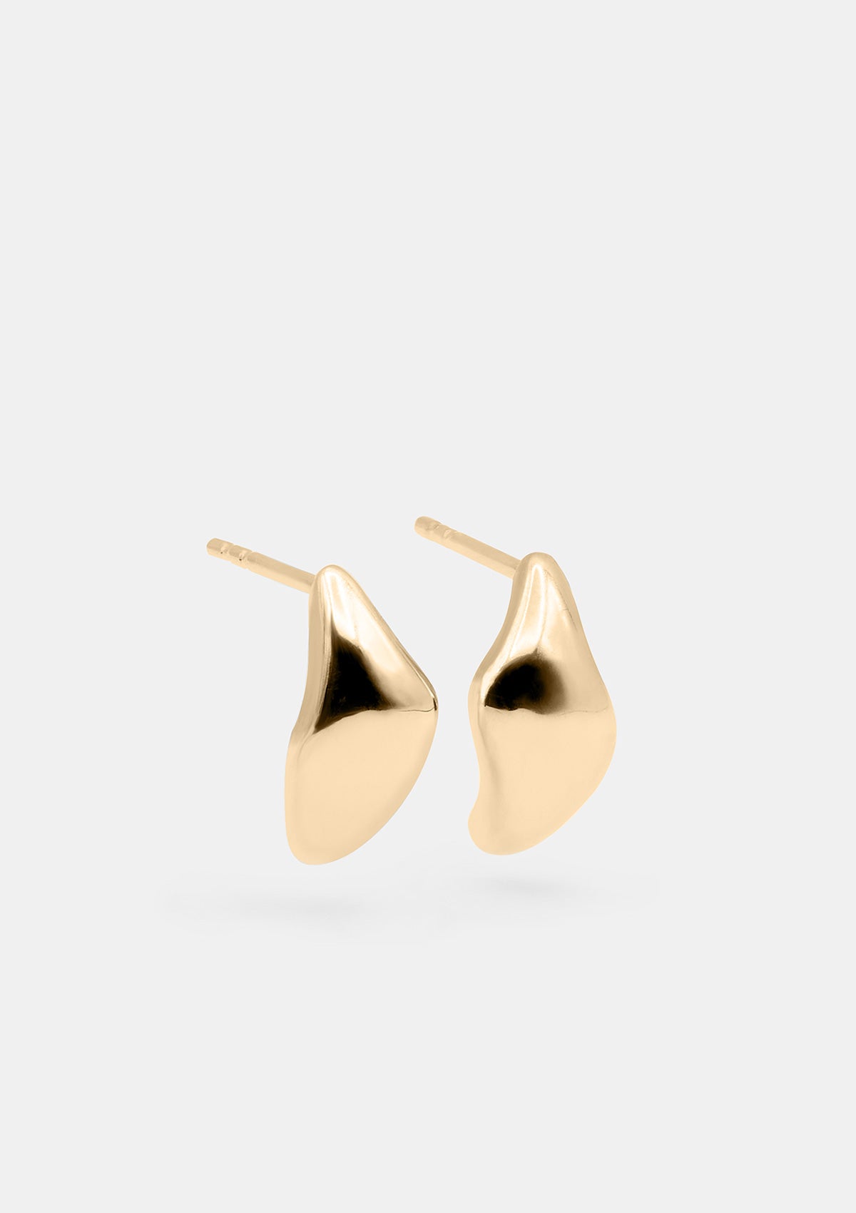 Close-up of 14k Thea gold earrings showing soft reflective shape