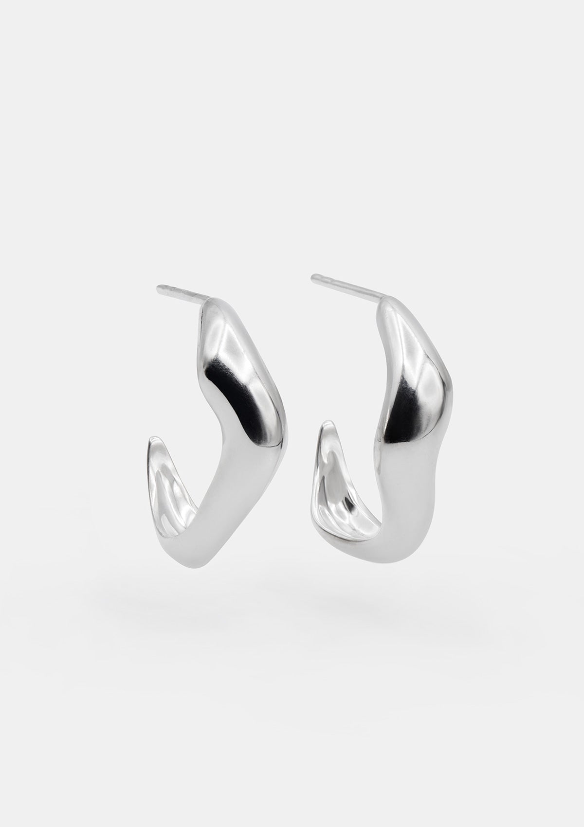 Sterling silver hoop earrings with soft curved silhouette, handcrafted everyday studs