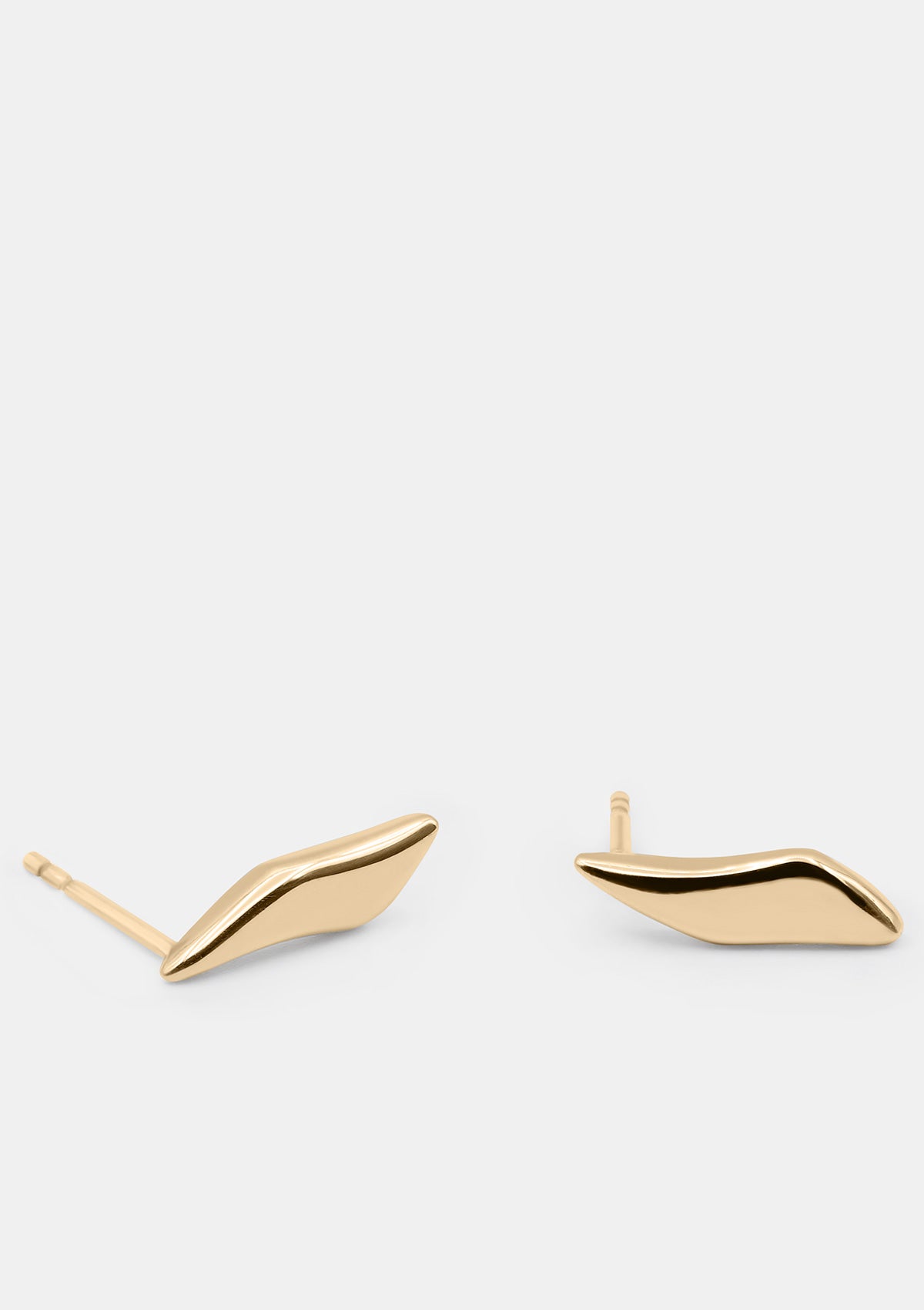 Subtle 14K gold earrings with unique wavy form, elegant designer jewelry for daily wear