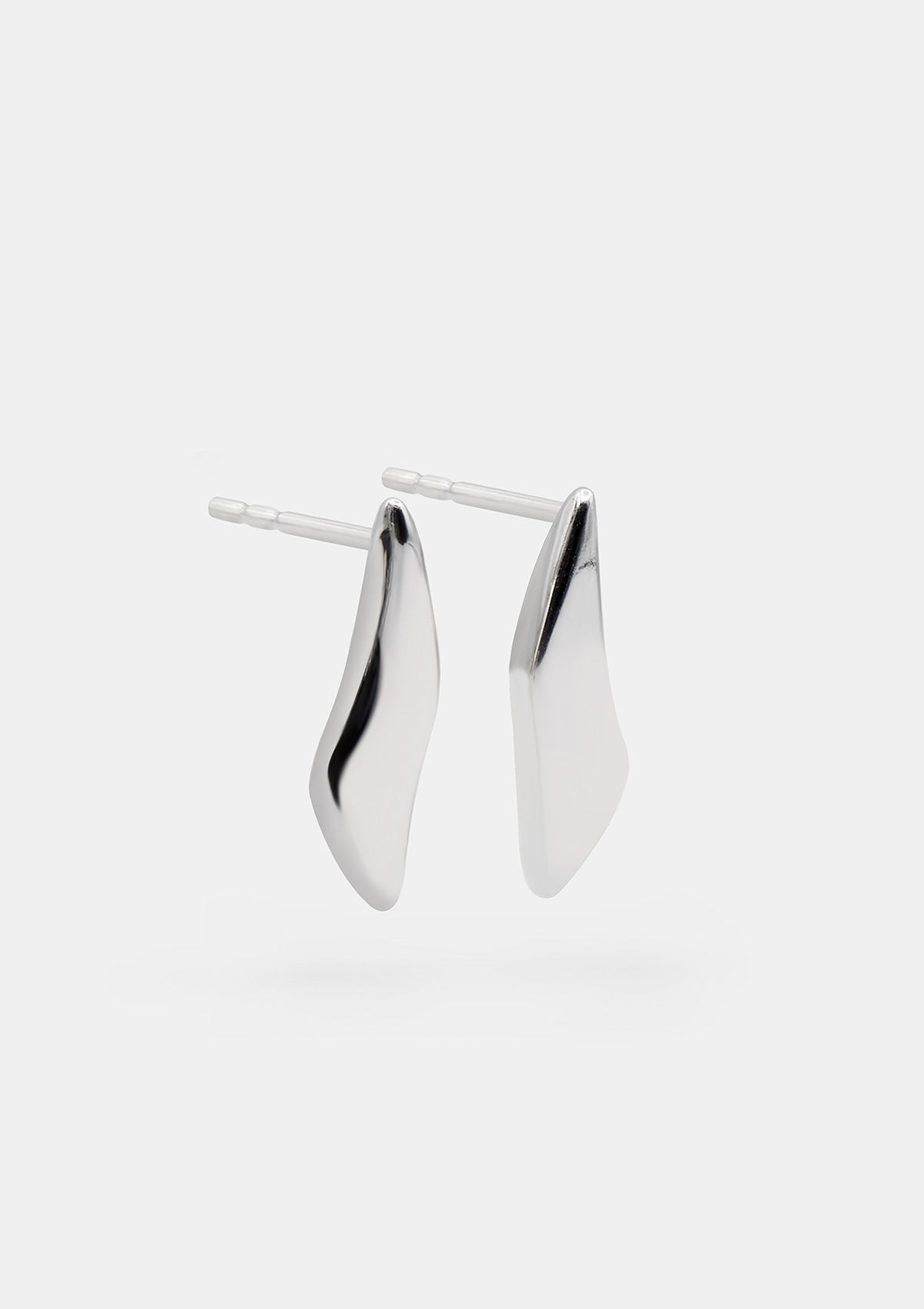 Small sterling silver earrings with sculptural wave shape, hypoallergenic everyday studs