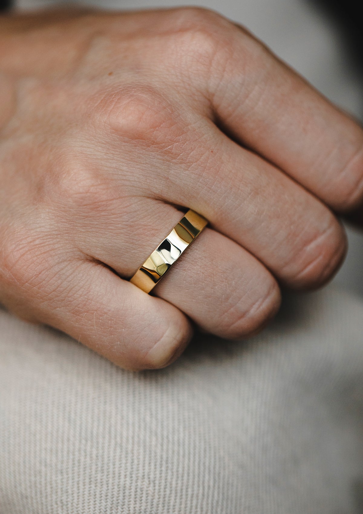 14k yellow gold men's ring on hand, minimalist faceted band