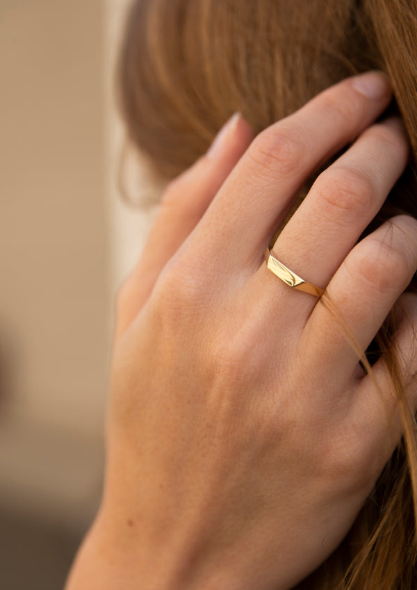 Gold small faceted signet ring