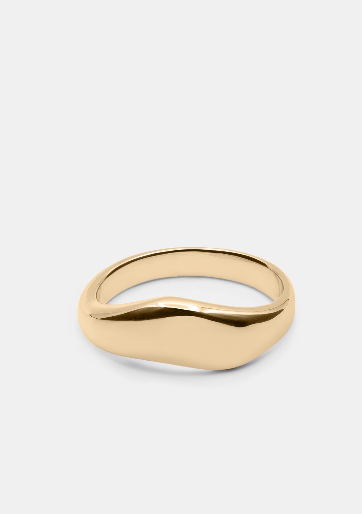 14k yellow gold sculptural ring with polished mirror finish on white background